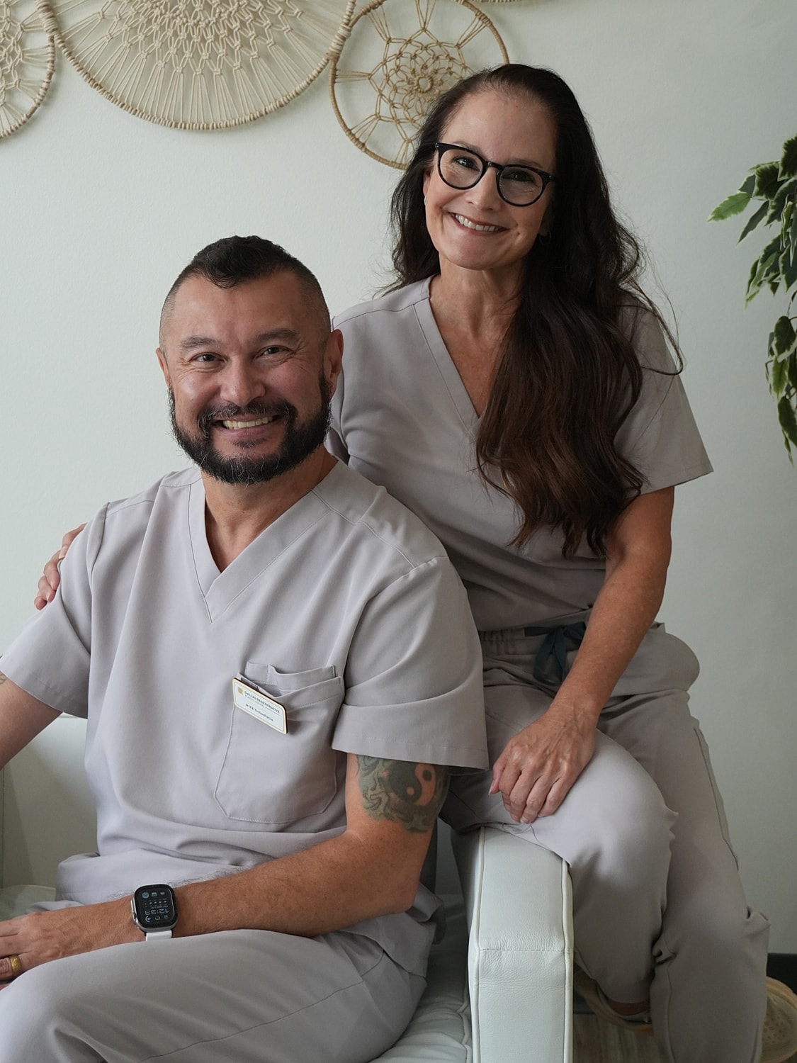 Two healthcare professionals smiling together.
